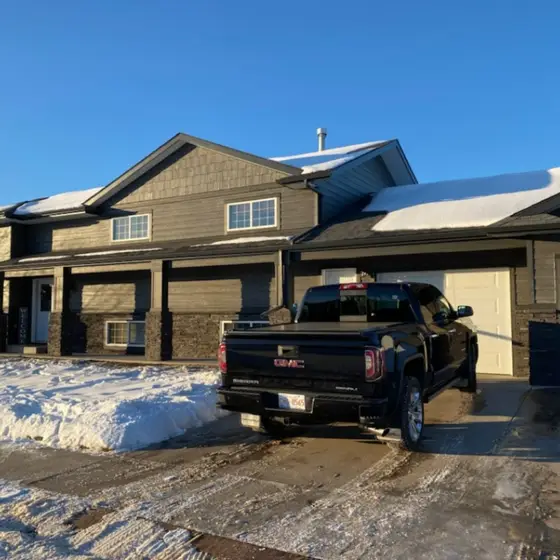Two-storey family home with fresh siding, stone accents and a new roof