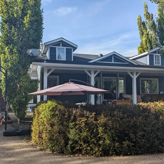 Craftsman bungalow with new shingles, dormers and a full siding package