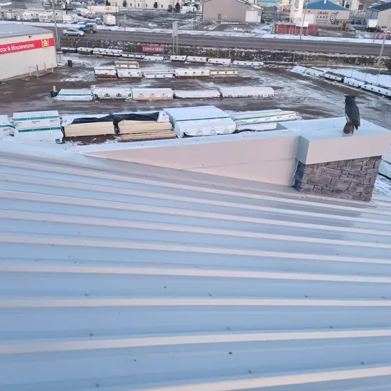 Commercial roof transition with stone-faced parapet, downtown Red Deer