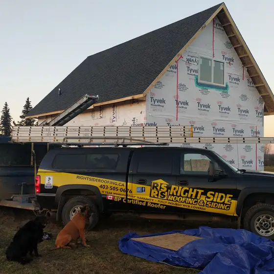 Right Side Roofing and Siding truck on site at a new build