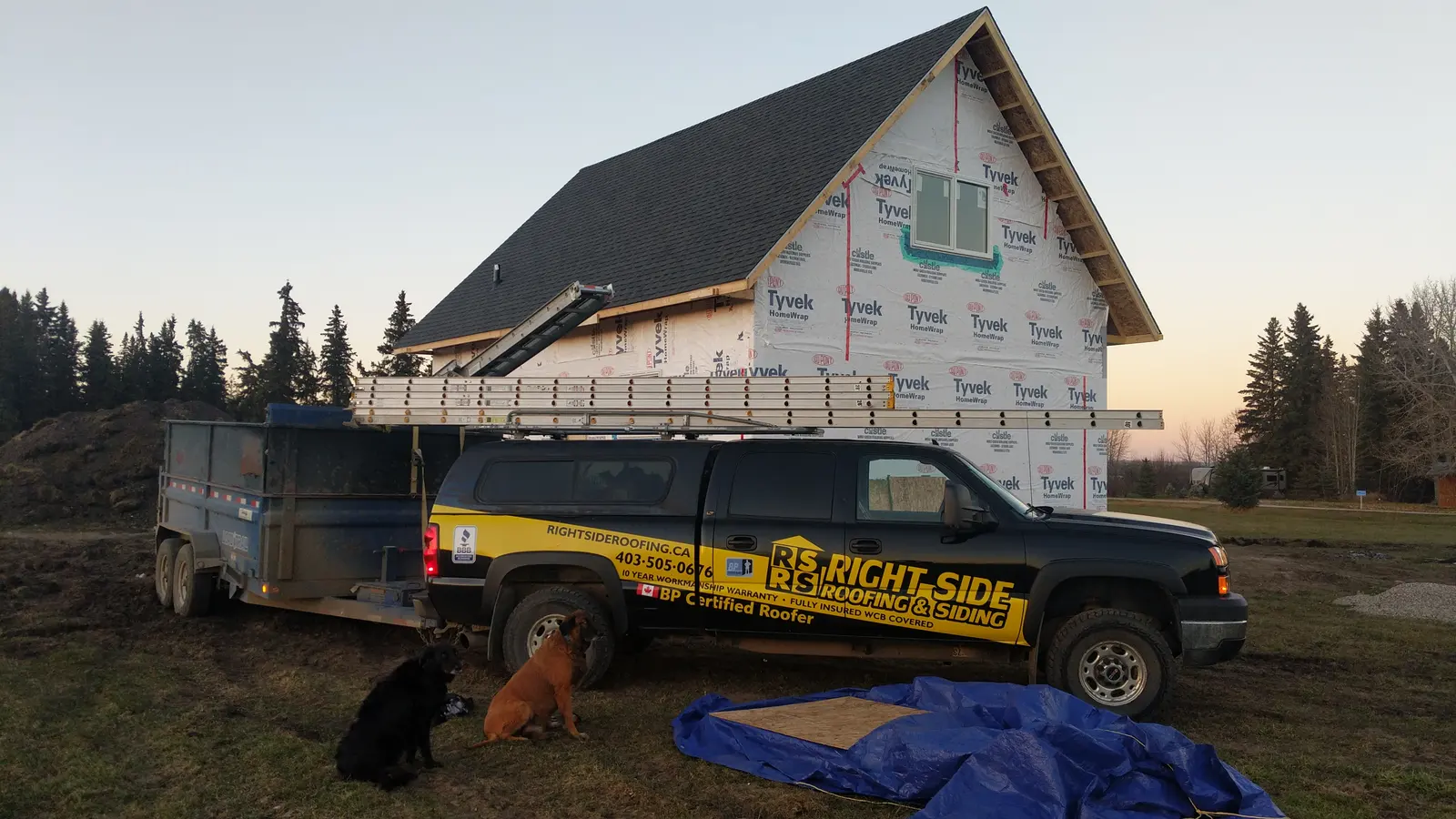 Right Side Roofing and Siding truck on site at a new build