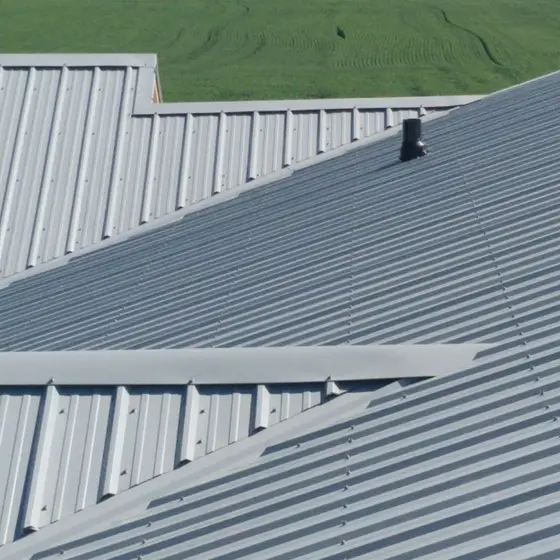 Standing-seam metal roof on a large farm building